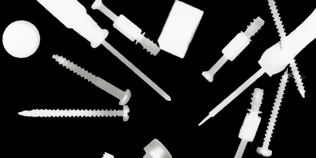 Screwdriver, screws and pegs in an x-ray